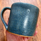 A greenish blue mug