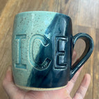light and dark blue mug with fuck ice carved into it