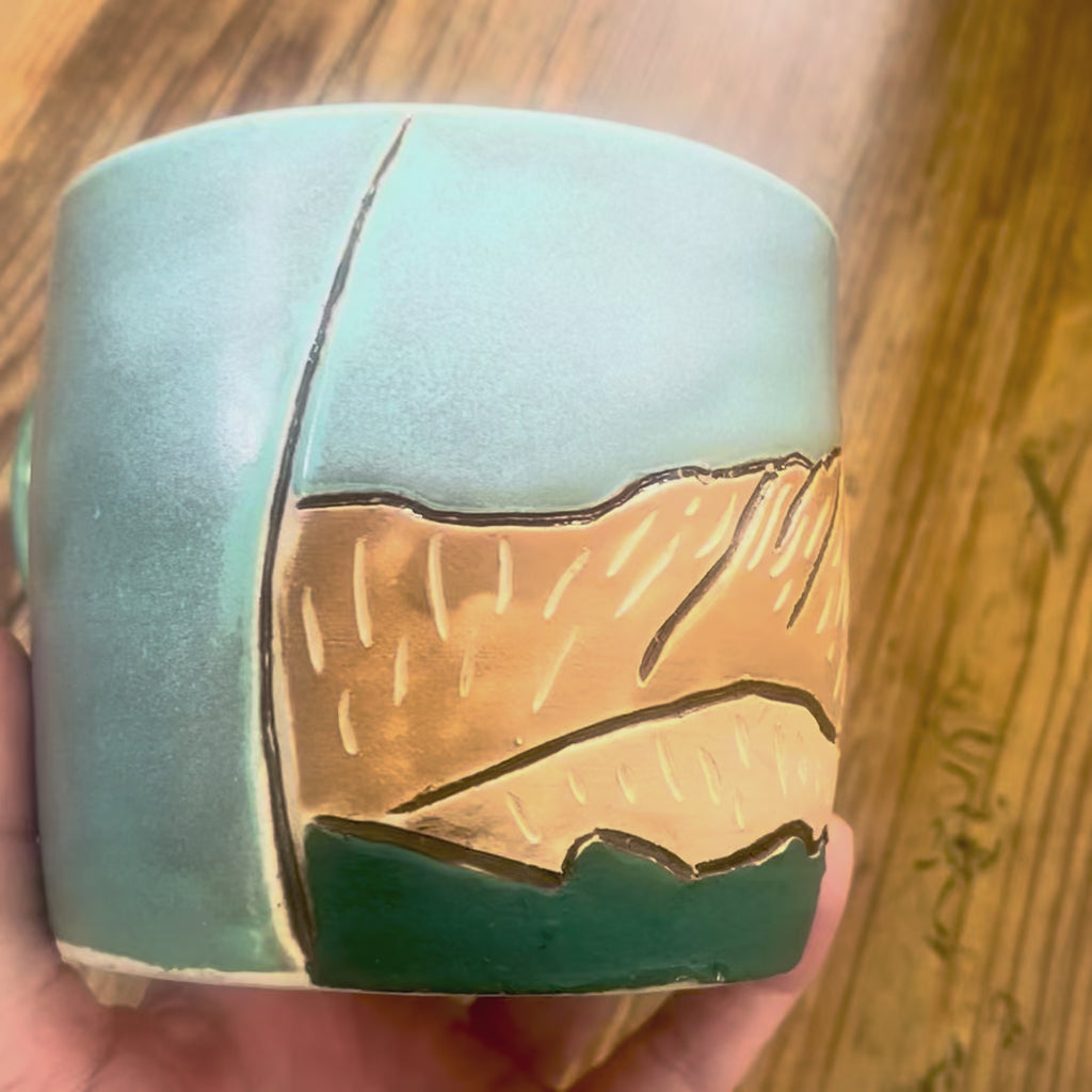 A video showing a mug with La Plata Peak, a Colorado 14er, carved on the mug