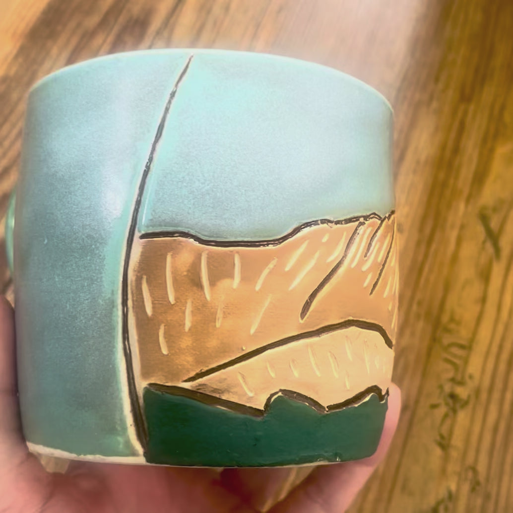A video showing a mug with La Plata Peak, a Colorado 14er, carved on the mug